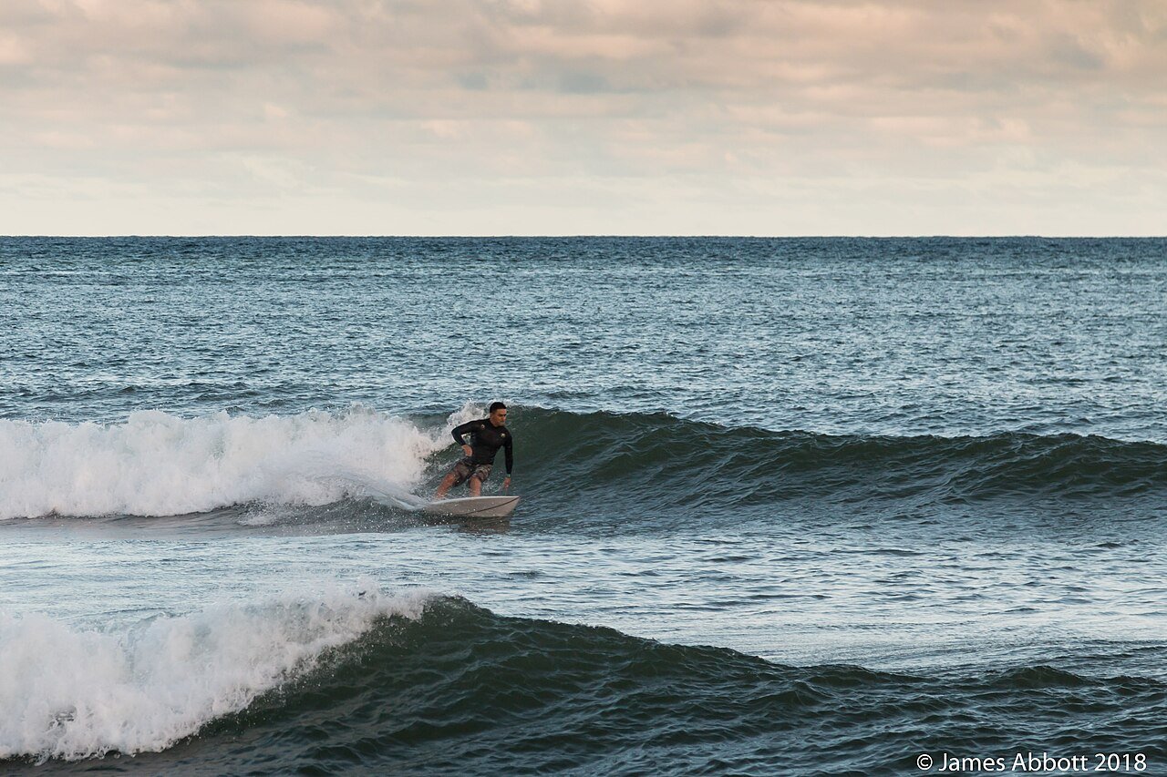 Surfer at Kalapaki Beach in Lihue