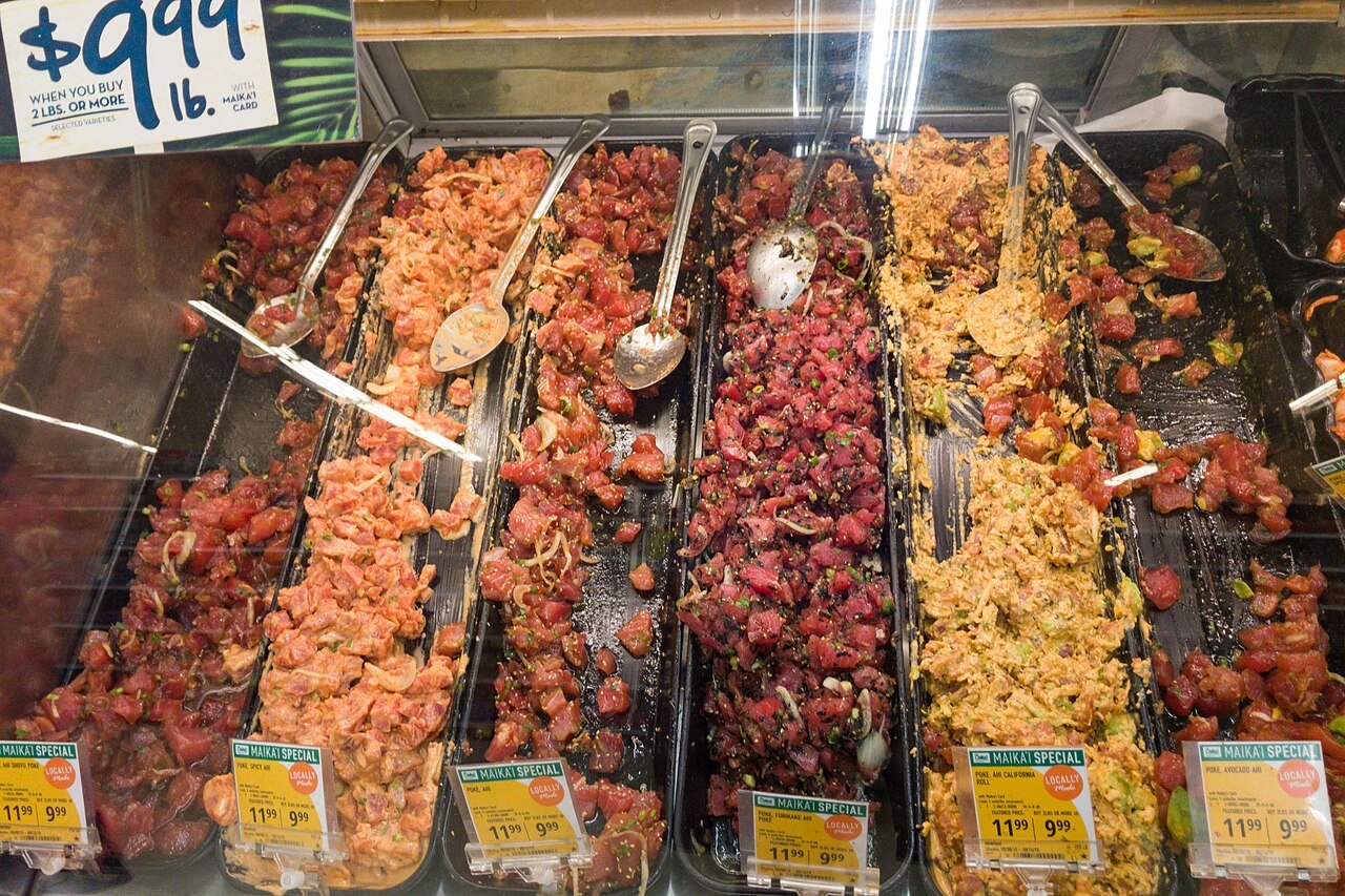 Trays of different kinds of poke at a Hawaii fish counter